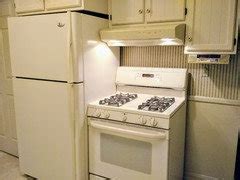 is it safe to put a refrigerator next to a stove